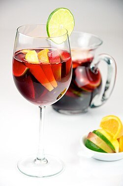 CARTA red wine sangria with lemon, lime, apple, and orange served in a glass evan swigart